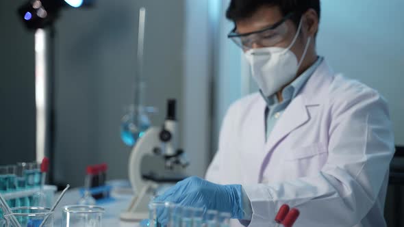 doctor scientist has researching a vaccine in the laboratory, meeting and writing analysis results