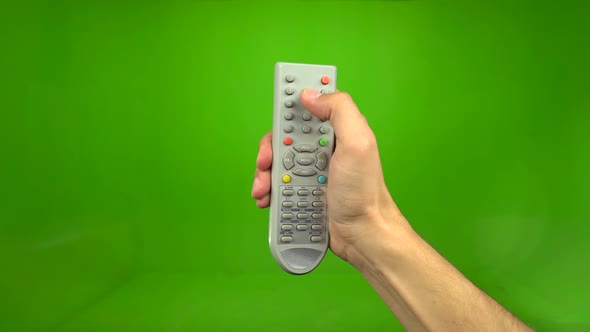 Male Hand Presses the Button On. Green Screen alt