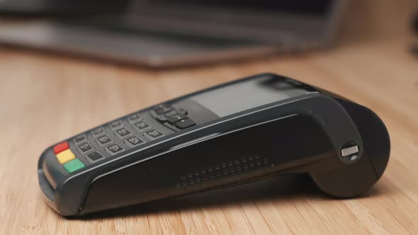 Male Hand Pays Using Credit Card By Contactless NFC Technology and Enters Pin Code or Password Using alt