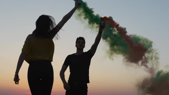 Having fun with colored smoke sticks alt