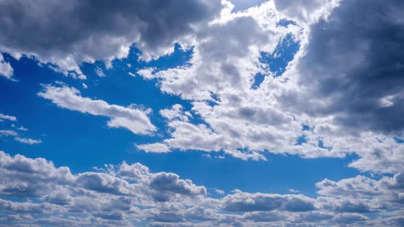 Timelapse of White Cumulus Clouds Moving in the Blue Sky Cloud Space alt