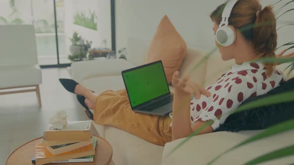 Back View Shot Of Business Woman Working In Home Interior On Laptop alt