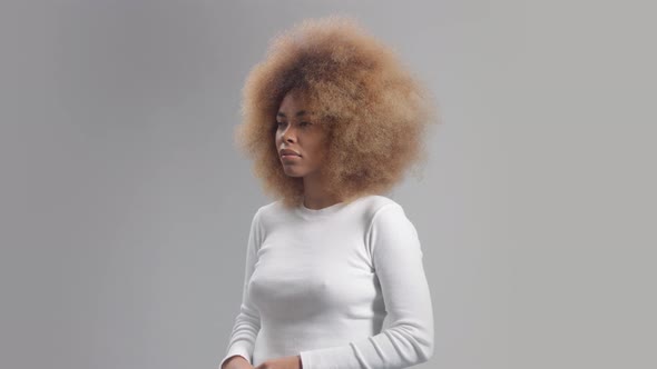 Mixed Race Black Woman with Big Afro Hair Panned Portrait
