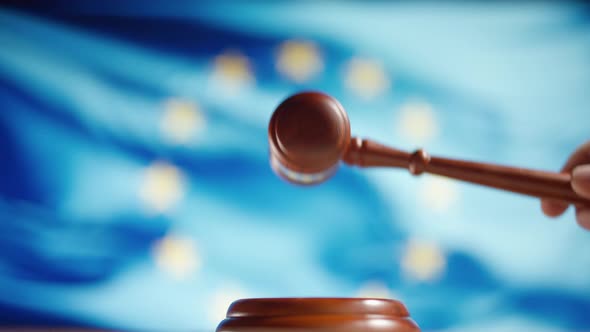 A Judge Gavel with a Flag of European Union on Background alt