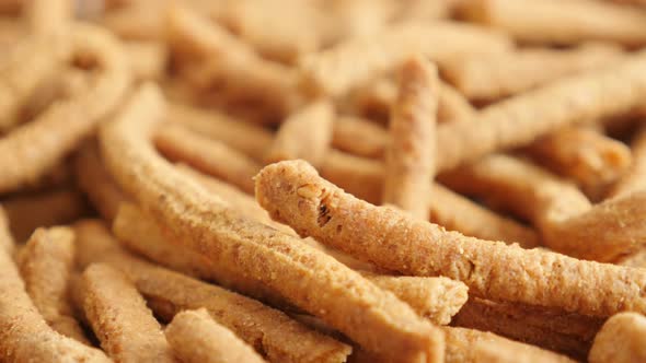 Tilting on crisp integral breadsticks snack with chilli 4K 2160p 30fps UltraHD footage - Tasty deep  alt