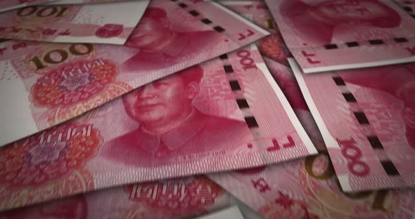 China Yuan 100 banknote flying over money surface