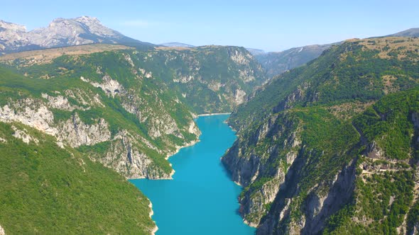 Aerial View of Lake Piva with Turquoise Water and Mountains in National Park Durmitor Montenegro alt