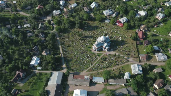 Aerial View of the Church and Cemetery in the Countryside alt
