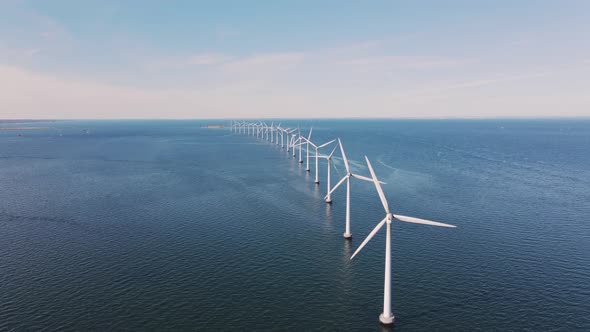 Drone Flies Over an Offshore Windmill Row in the Ocean