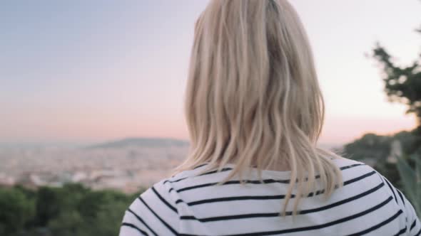 Young adult woman enjoying view of Barcelona