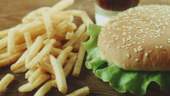 Hamburger a Sandwich And French Fries On a Tray alt