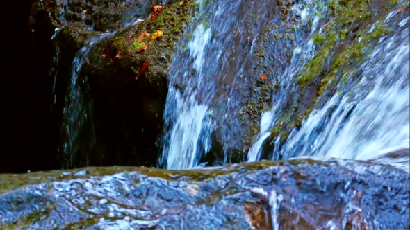 Waterfall Water Flowing Down On Stones