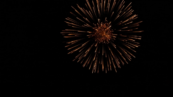 Golden Orange Balls Of Fireworks Isolated On Dark Background