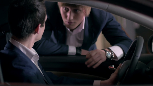 Customer Inspecting Car Interior alt