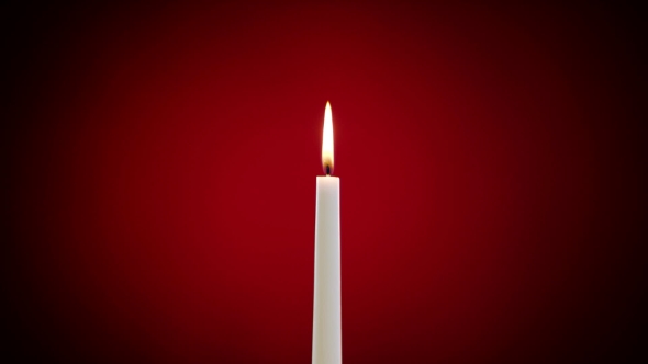 Burning Candle On a Red Background by nicepictures | VideoHive