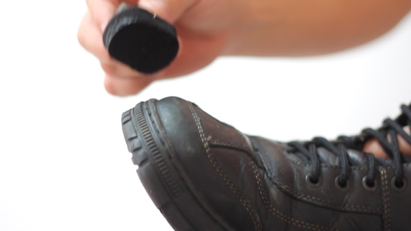 Man Polishing Leather Black Shoes 
