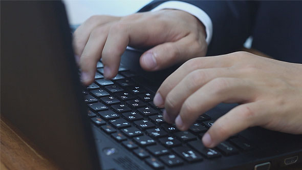 Man Typing on Laptop Vertical Lift Camera alt