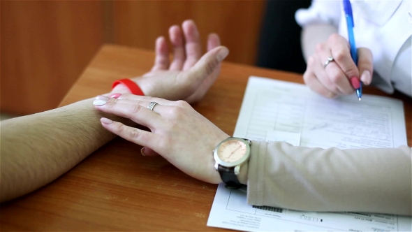 Heart Rate Measurement: Doctor Measures Pressure To The Patient