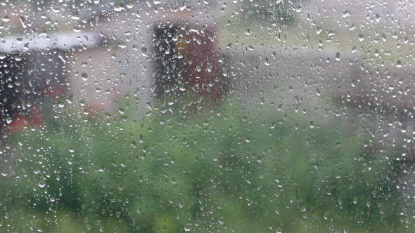 Rain Drops Running Down On Window Glass