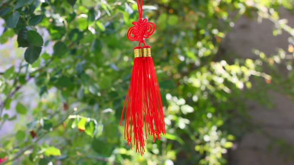 Red Asian Knot Talisman Decoration In The Wind