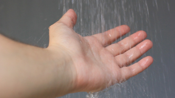 Man Washing His Hand With Water In Shower