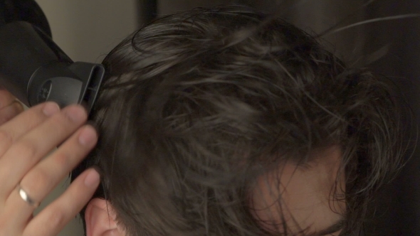Barber Makes Styling Hair With Hair Dryer And Hands