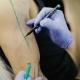 Tattoo Master Draws a Line In Green Marker On Shoulder - VideoHive Item for Sale