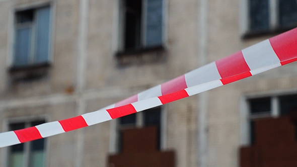 Danger Ribbon In Front of Abandoned House alt