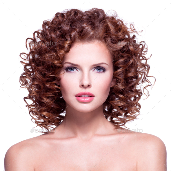 Beautiful woman with brunette curly hair. Stock Photo by valuavitaly