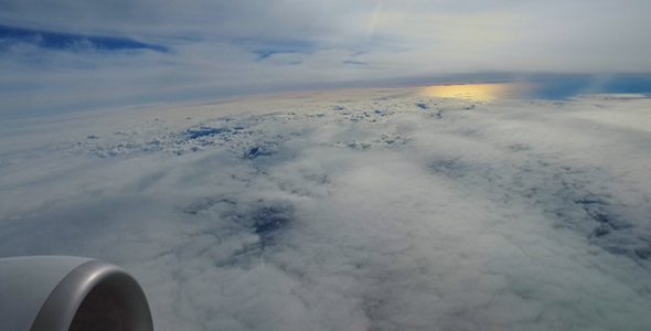 Airplane Flight Above Clouds