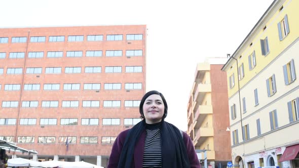 Young curvy woman looking camera smiling serene alt