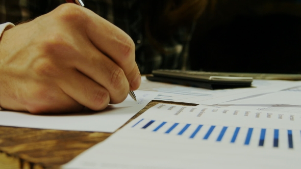 Businessmen And Businesswoman Working With Business Charts And Diagrams alt