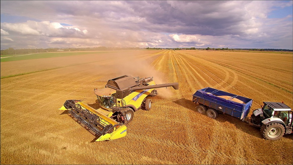 The Harvester and the Truck Reaching the End of the Field