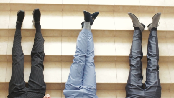 Young Men Wearing Stylish Shoes On Stoned Stairs