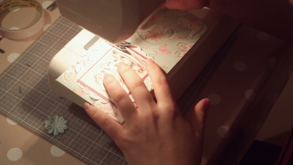 Hands Of a Woman Crafting And Scrap-booking Christmas Cards alt