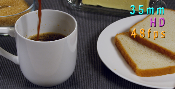Coffee Being Poured Next To Buttered Toast On a Plate
