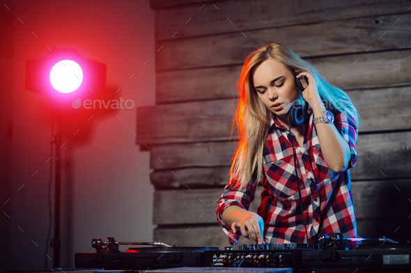 Cute dj woman having fun playing music at club party Stock Photo by arthurhidden