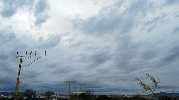 Airport Lampposts and Clouds at Sunset alt
