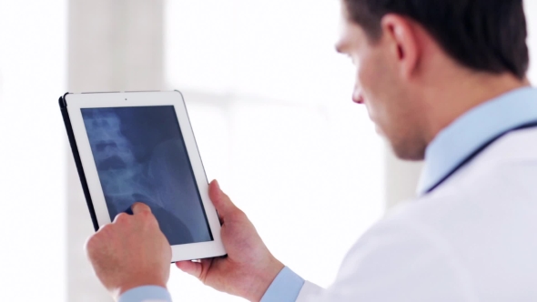 Doctor With X-ray Scan On Tablet Pc 46 alt