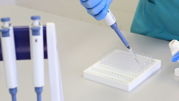 Distribution Of The Reagent Dispenser In Multikyuveta Tracks With Samples For Biochemical Analyzer. alt