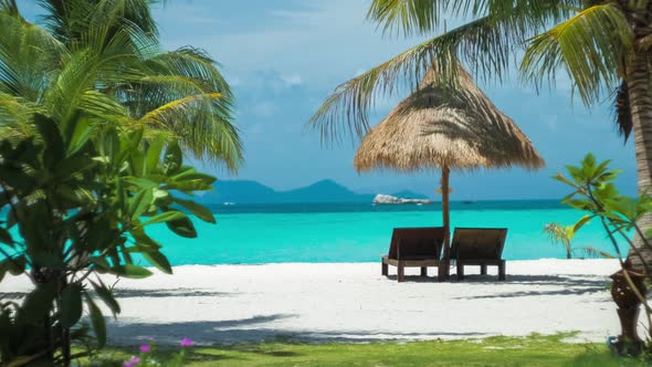 Beach Chairs, Umbrella and Palms on the Beach. Dreamy Look. Koh Lipe Island, Thailand, Asia alt