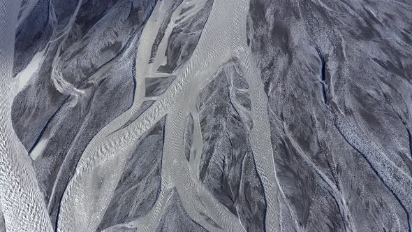 Abstract Aerial Top Down View Perspective of Glacial Melt Water River Streams in Iceland alt