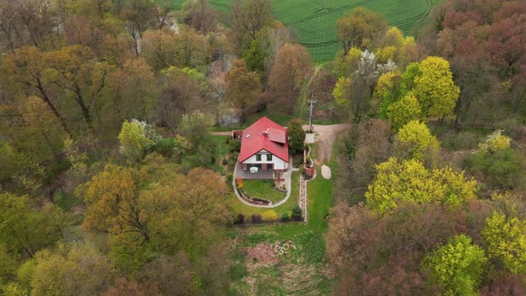 Aerial View of Alone House in Nature alt