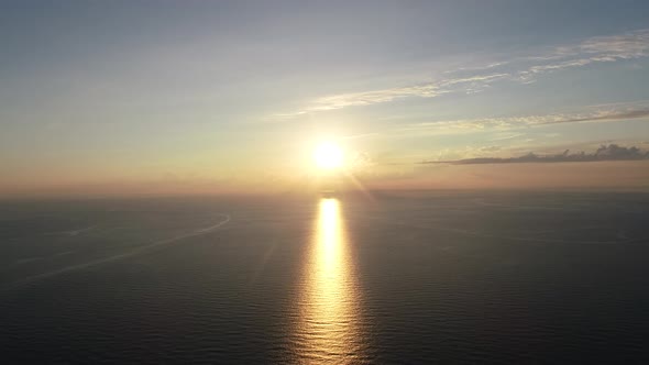 Flying Over Sea at Sunset