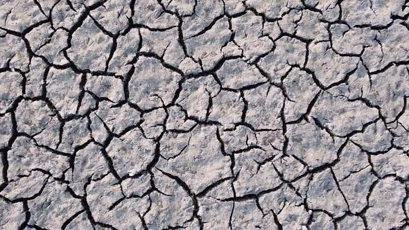 Vertical orientation video: Dried up lake. Cracked soil ground of dried lake or river
