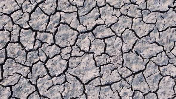 Vertical orientation video: Dried up lake. Cracked soil ground of dried lake or river alt