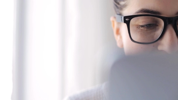 Young Woman In Eyeglasses With Tablet Pc At Home alt