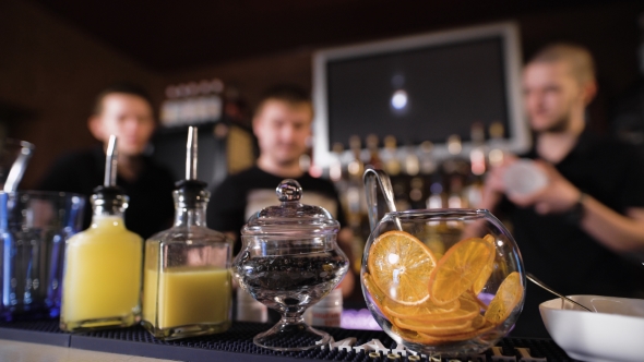 Active Night. The Bartenders At Work, Take Orders, Make Cocktails alt