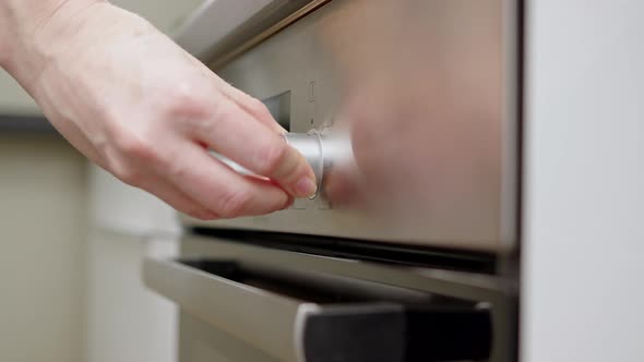 Cook or Housewife Turn Off Oven and Stop Cooking Process