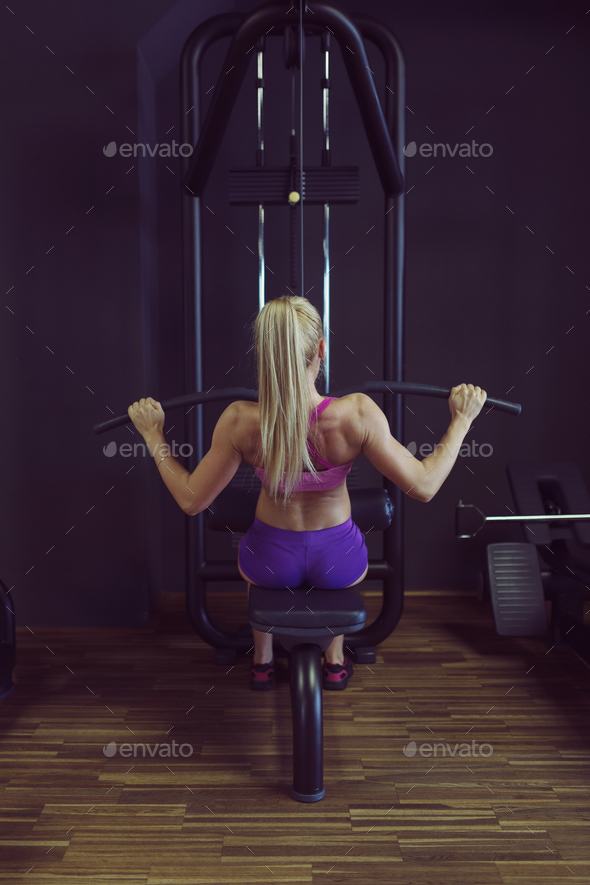 Strong and beautiful athletic woman training in the gym Stock